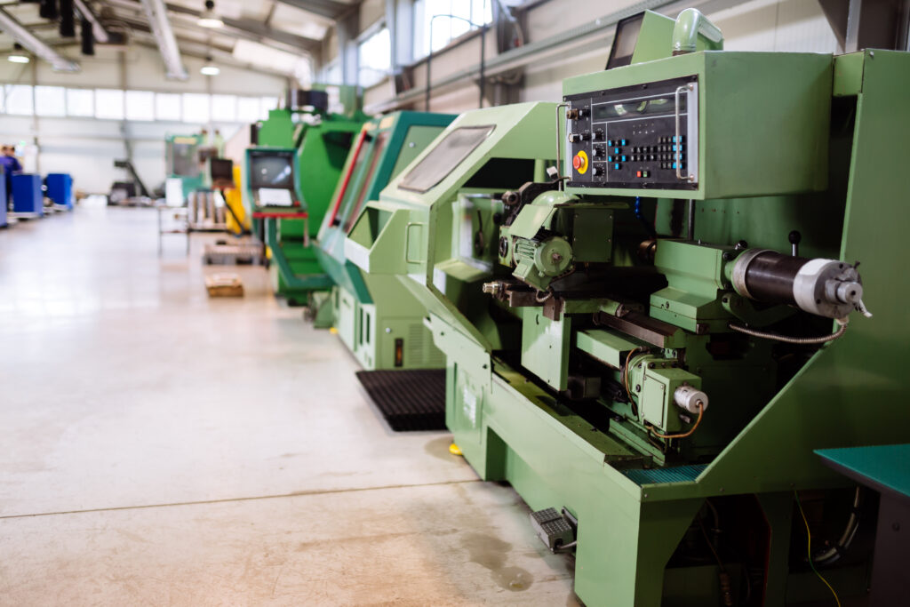 Industrial factory with cnc machines and workers